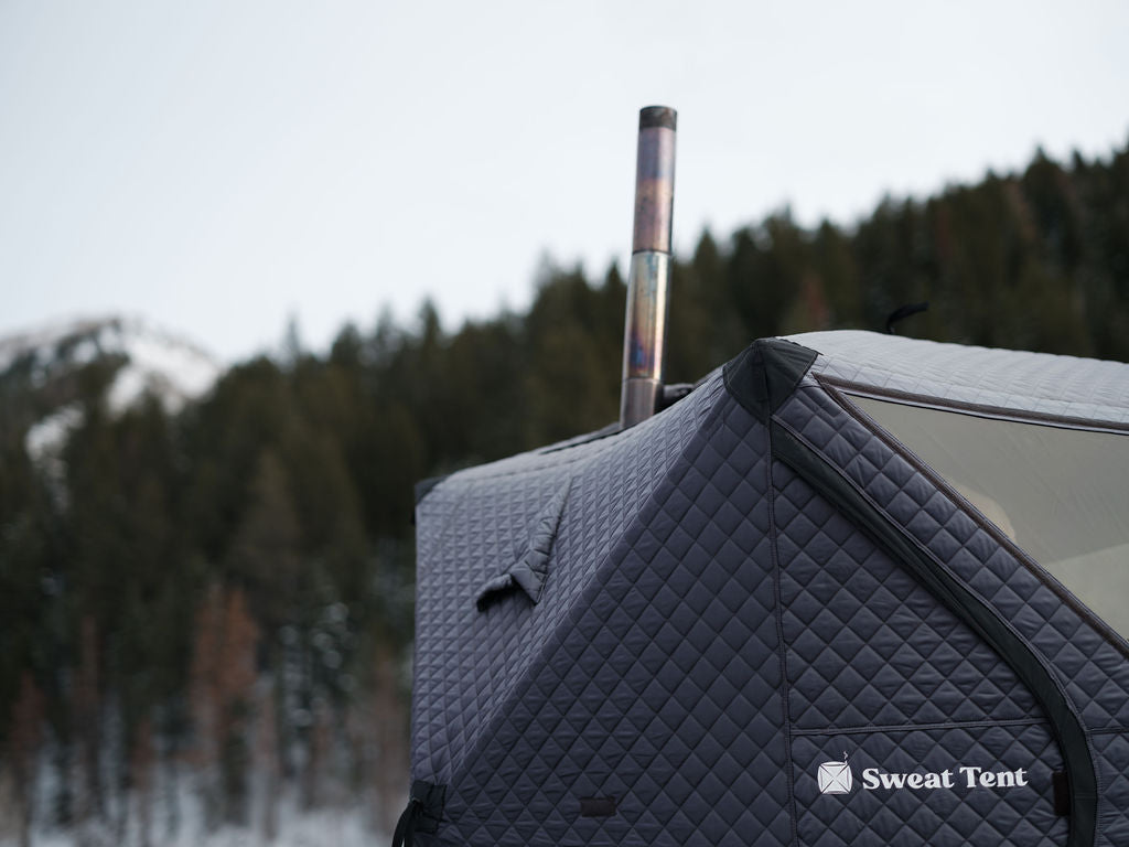 Closeup of a chimney sticking out of a sauna tent