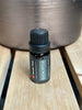 An image of eucalyptus sauna oil on a wood bench