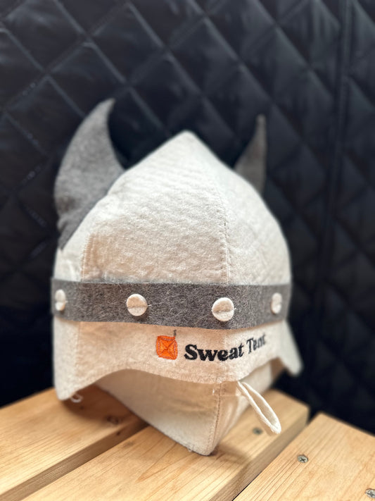 A white wool sauna hat shaped like a Viking helmet
