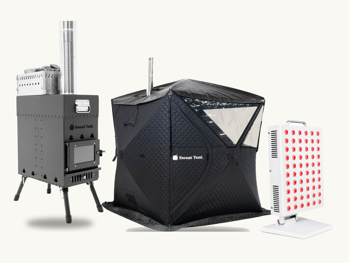 The Sweat Tent wood-fired stove with its sauna rocks and chimney, the black sauna tent, and the white SunPanel Mini red light panel